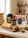 The Pantry at MA VIE: Mariage Freres Marco Polo tin, Jamagansett preserves and Eleven Madison Home bar nuts on a stone counter