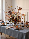 The Autumn Table at MA VIE: transferware plates, brass candlesticks and ivory tapers on a linen-dressed table in a Paris apartment