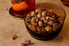 Nori Bar Nuts by Eleven Madison Home in a dark glass bowl, maker photo