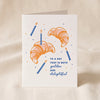 Birthday Croissant letterpress greeting card by Dahlia Press standing on a natural cotton backdrop
