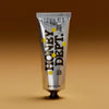 Honey Department Thick Honey 6 oz tube, maker's packshot on a brown gradient