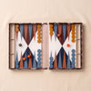 Acrylic backgammon set by Printworks shown open with pieces and dice on the MA VIE cotton backdrop