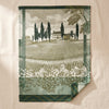 Vignoble jacquard tea towel by Le Jacquard Français laid open on the MA VIE cotton backdrop