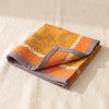 Manor Lane napkin folded, showing the hem and the weight of the cloth