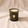 The Field Candle in Heirloom + Argan by House of Good, double-wick soy candle in a moss green glass vessel
