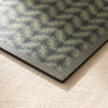 Sulawesi Feuillage placemat corner in close detail, showing the woven ferns and the wipeable coated surface