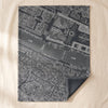 A Vol d'Oiseau Paris jacquard tea towel by Le Jacquard Français, an aerial map of central Paris, on the MA VIE cotton backdrop