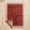 Médicis jacquard tea towel by Le Jacquard Français, a classical urn in terracotta, on the MA VIE cotton backdrop
