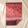 Romance jacquard tea towel by Le Jacquard Français in coral and aubergine, on the MA VIE cotton backdrop