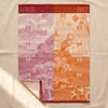 Calendrier 2027 jacquard tea towel by Le Jacquard Français, a twelve month calendar in pink and orange, on the MA VIE cotton backdrop