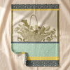 Potager d'Hiver jacquard tea towel by Le Jacquard Français in Poireau, a basket of winter vegetables, on the MA VIE cotton backdrop