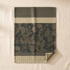 Sulawesi jacquard tea towel by Le Jacquard Français, tropical foliage on dark forest green, on the MA VIE cotton backdrop