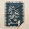 Curiosités Animales jacquard tea towel by Le Jacquard Français, birds and butterflies under a glass dome, on the MA VIE cotton backdrop
