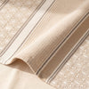 Dune Rayures jacquard damask folded back to show the same stripe structure woven on the reverse in the opposite colourway