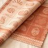 Haute Viennoiserie jacquard damask folded back to show the same nine named pastries woven on the reverse in the opposite colourway