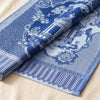 Promenade Impériale jacquard damask folded back to show the same chinoiserie pavilion woven on the reverse in the opposite colourway