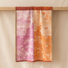 Calendrier 2027 jacquard tea towel draped over an oak edge, showing how the cloth hangs