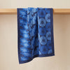 Yukata jacquard tea towel draped over an oak edge, showing how the cloth hangs