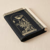 Curiosités Florales jacquard tea towel folded, showing the weight and thickness of the cloth