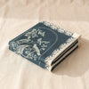 Curiosités Animales jacquard tea towel folded, showing the weight and thickness of the cloth