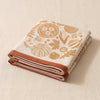 Thanksgiving jacquard tea towel folded, showing the weight and thickness of the cloth