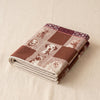 Truffes jacquard tea towel folded, showing the weight and thickness of the cloth