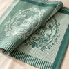Promenade Impériale in Jade folded back to show the same chinoiserie pavilion woven on the reverse in the opposite colourway
