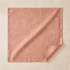Vegetal Mood jacquard napkin in Papaye laid open on the MA VIE cotton backdrop, the acacia damask read in sheen