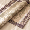 Manor Lane napkin in Rosé des prés turned back to show the damask design woven on both faces
