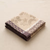 Manor Lane napkin in Rosé des prés folded, showing the hem and the weight of the cloth