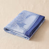 Promenade Impériale napkin folded, showing the hem and the weight of the cloth