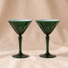 Rialto Martini Glasses in Kale, set of two mouth-blown cased glass martini glasses by Sir/Madam, on a natural cotton backdrop