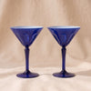 Rialto Martini Glasses in Midnight, set of two mouth-blown cased glass martini glasses by Sir/Madam, on a natural cotton backdrop