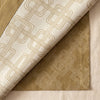 Hôtel Particulier linen tablecloth folded back to show the reverse of the Boiseries damask
