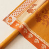 Manor Lane tablecloth folded back to show the reverse, the woven design swapping ground and drawing