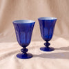 Rialto Tulip Glasses in Midnight, set of two mouth-blown cased glass tulip glasses by Sir/Madam, on a natural cotton backdrop