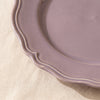 Close detail of the Lavender dinner plate rim, its lobed edge and raised moulding