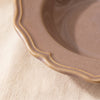Close detail of the Lavender soup plate rim, its lobed edge and raised moulding