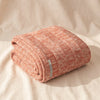 Cable Knit Baby Alpaca Throw in Melon by Alicia Adams Alpaca, folded