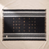 Reversible Baby Alpaca Throw in Black by Alicia Adams Alpaca, opened flat showing the Southwestern pattern
