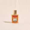 Pompeia eau de parfum by L.T. Piver on a natural cotton backdrop