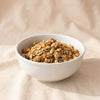 Apple Cider Granola by Eleven Madison Home, MA VIE studio, served in a white bowl