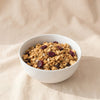 Apple Cranberry Granola by Eleven Madison Home, MA VIE studio, served in a white bowl