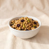 Cherry Pistachio Granola by Eleven Madison Home, MA VIE studio, served in a white bowl