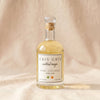 Gris Gris Cocktail Magic basil habanero simple syrup bottle on MA VIE cotton