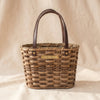 Millstream Home small market basket, handwoven splint with leather handles and MA VIE brass nameplate, on MA VIE cotton