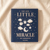 Little Miracle embroidered baby photo album by Printworks, navy cloth cover with clouds, stars and a sleeping moon, on MA VIE cotton