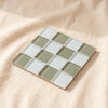 Glass tile coaster in Matcha Milk Chocolate, matcha green and milk white checkerboard, by Subtle Art Studios