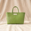 Tennis woven basket bag seen from the plain reverse side, by Duggan Society