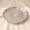 Queen Anne round Chippendale tray in silver plate seen at an angle, by Corbell Silver
